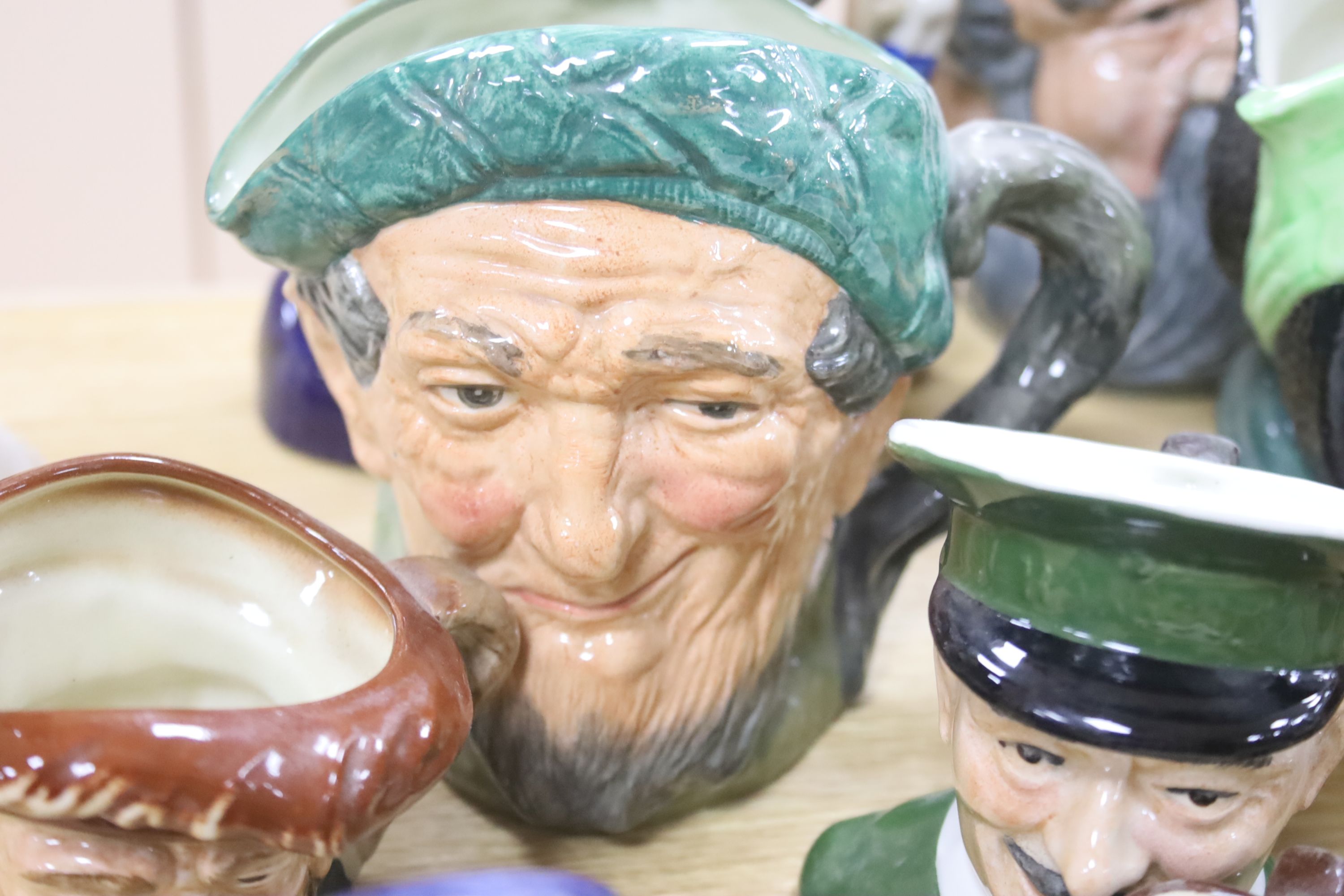 A collection of seventeen Royal Doulton character mugs